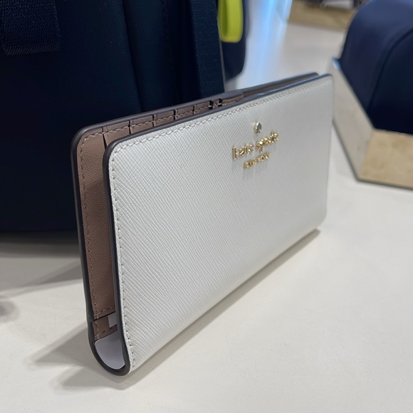 Kate Spade Madison Large Slim Bifold Wallet
Meringue 
NWT - Picture 16 of 16